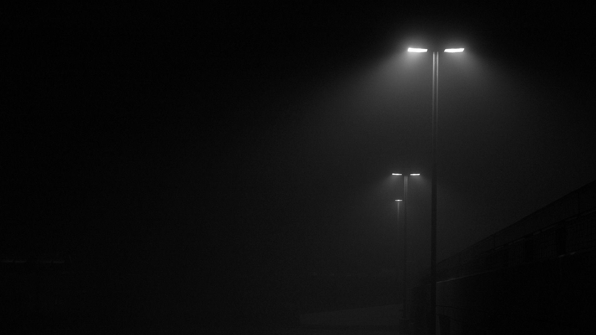 Atmospheric street lights in darkness creating dramatic lighting